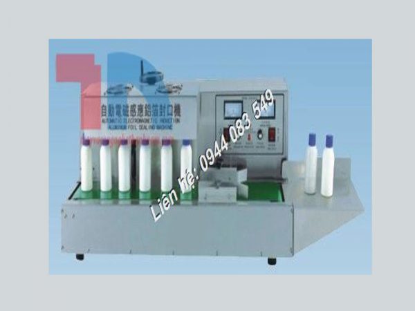 Máy dán màng seal tự động